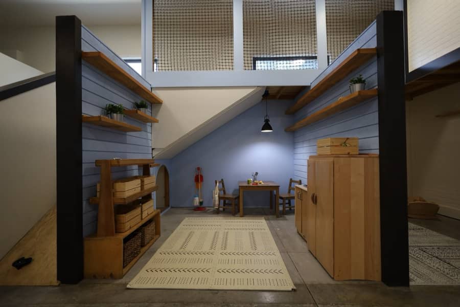 A quiet play nook beneath the stairs